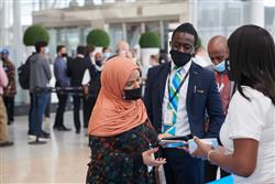 Employees talking at the I Am Toronto Pearson Thank You event