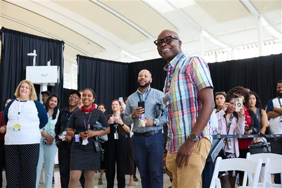 a group of people standing in a tent