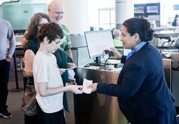 a man and a child looking at a paper