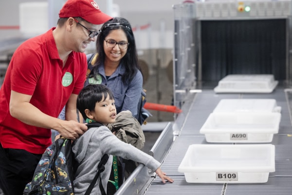 a man and woman with a baby