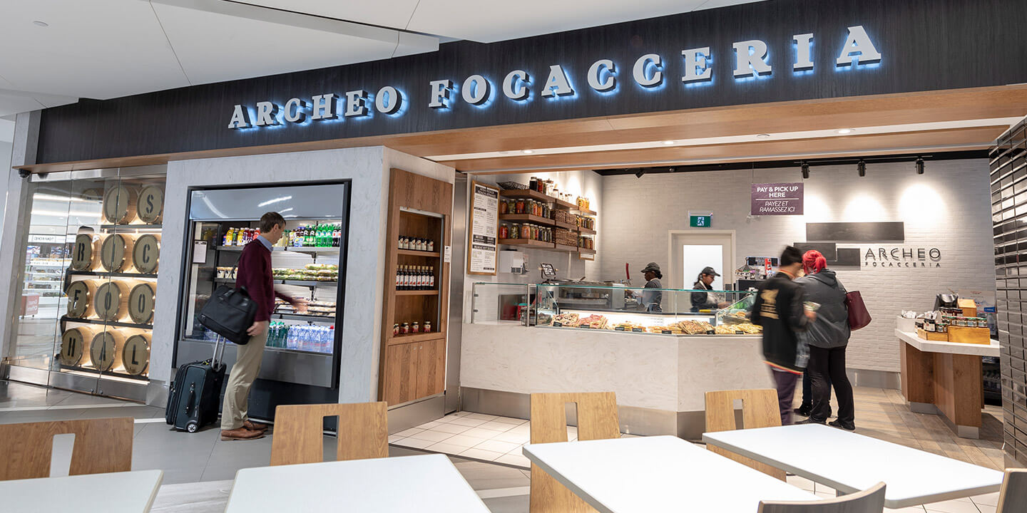 View of Archeo with self-serve drink fridge and ordering counter