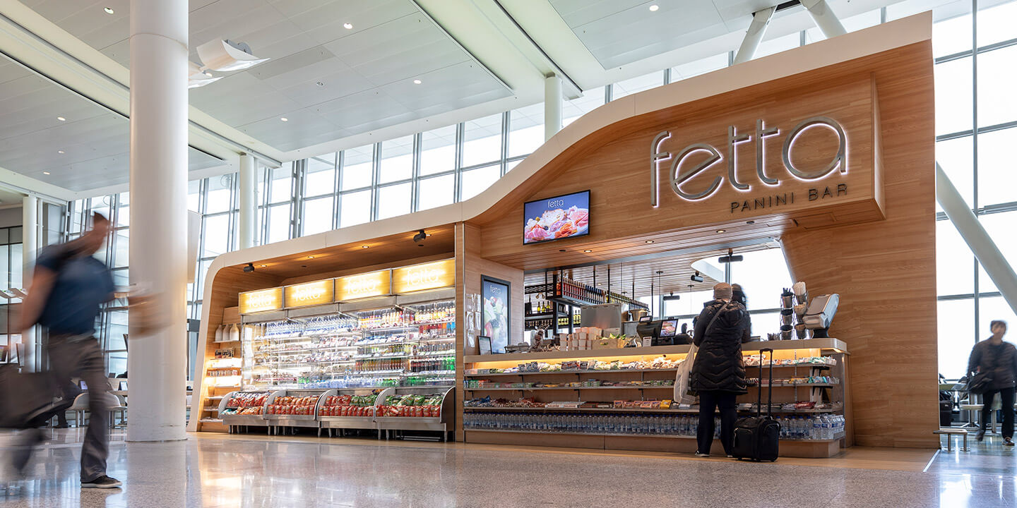 Fetta sign and ordering bar with adjacent to-go fridge