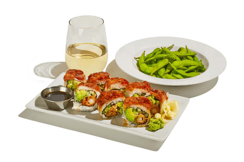 Sushi rolls, edamame and white wine.
