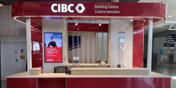 a red and white building with a sign above the door