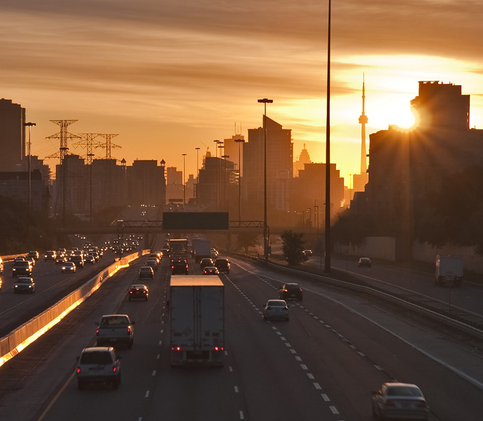 A low-sunlight view of traffic in downtown Toronto