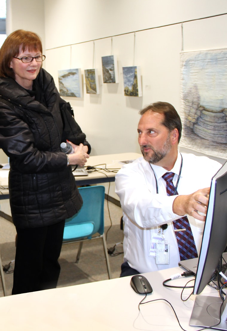 A member of the community confers with a Toronto Pearson employee