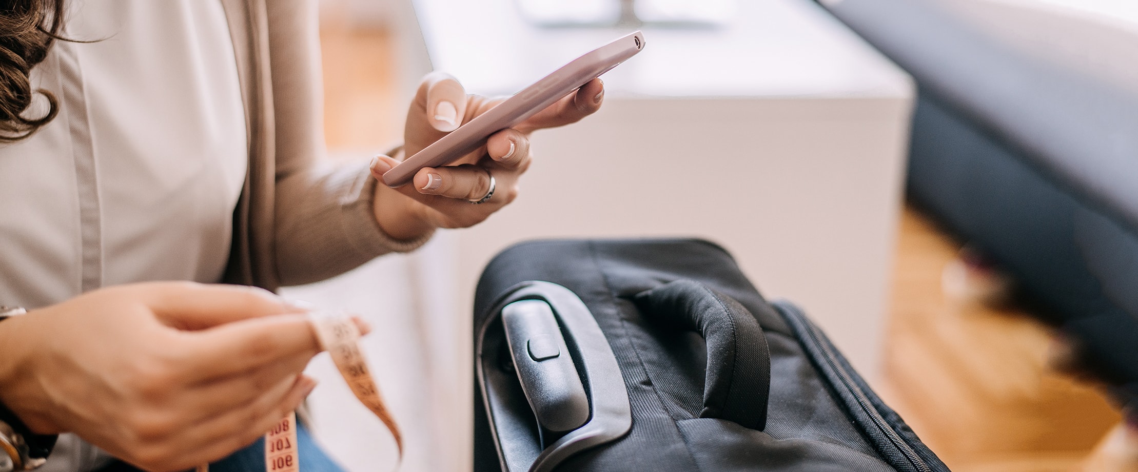 A traveller using a smartphone at an airport