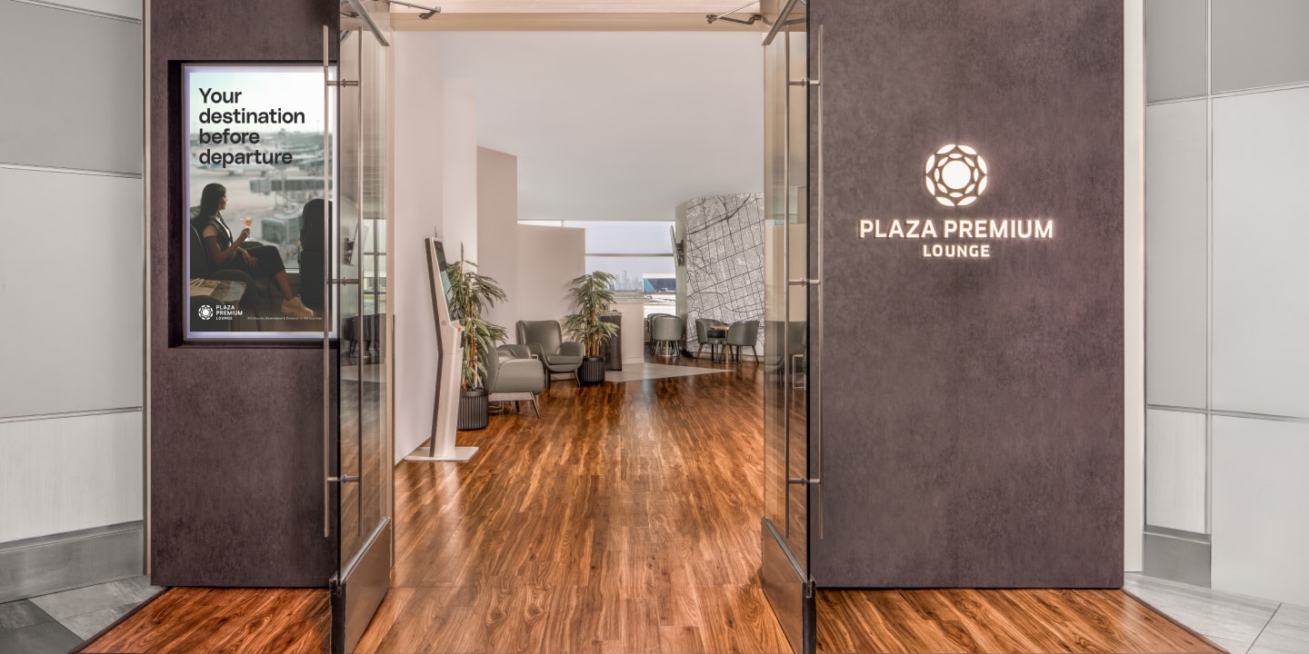 a room with a glass door and a wood floor