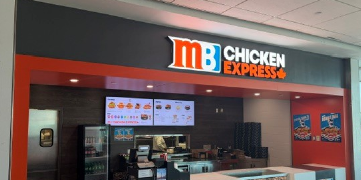 a restaurant with a sign above the door