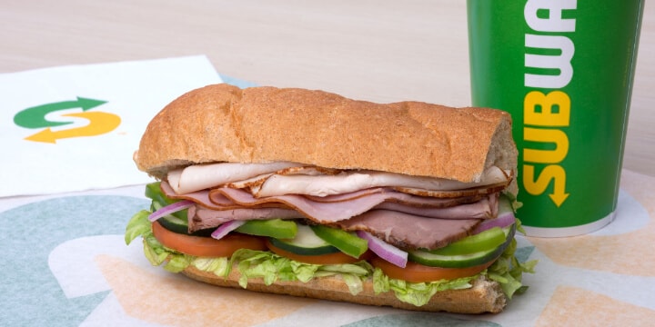 A Subway sandwich and a drink
