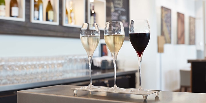 Three glasses of wine on the Vino Volo bar counter