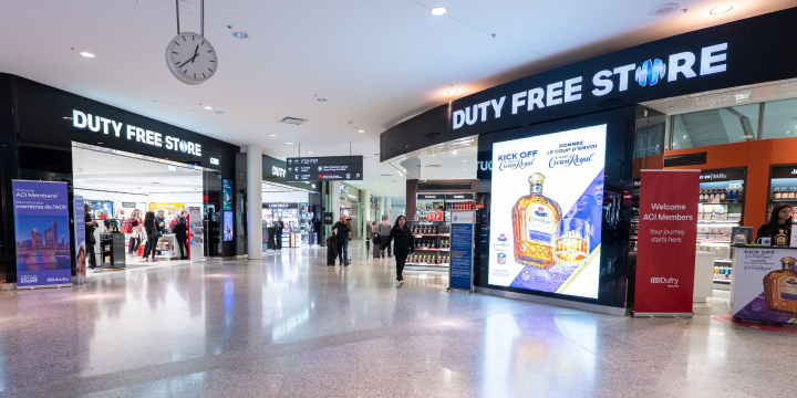 a large shopping mall with a large sign and a clock